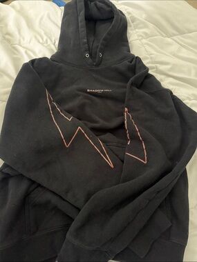 Shadow Hill Black Hoodie with Pink/Orange Lightning Sleeve Graphics